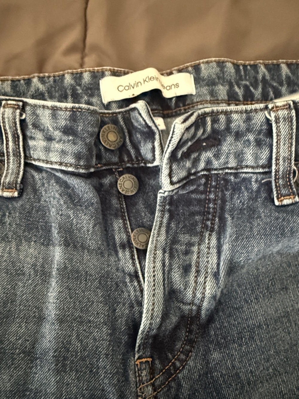 Calvin Klein Jeans blue denim button fly with a classic slim fit. Mens 34x32